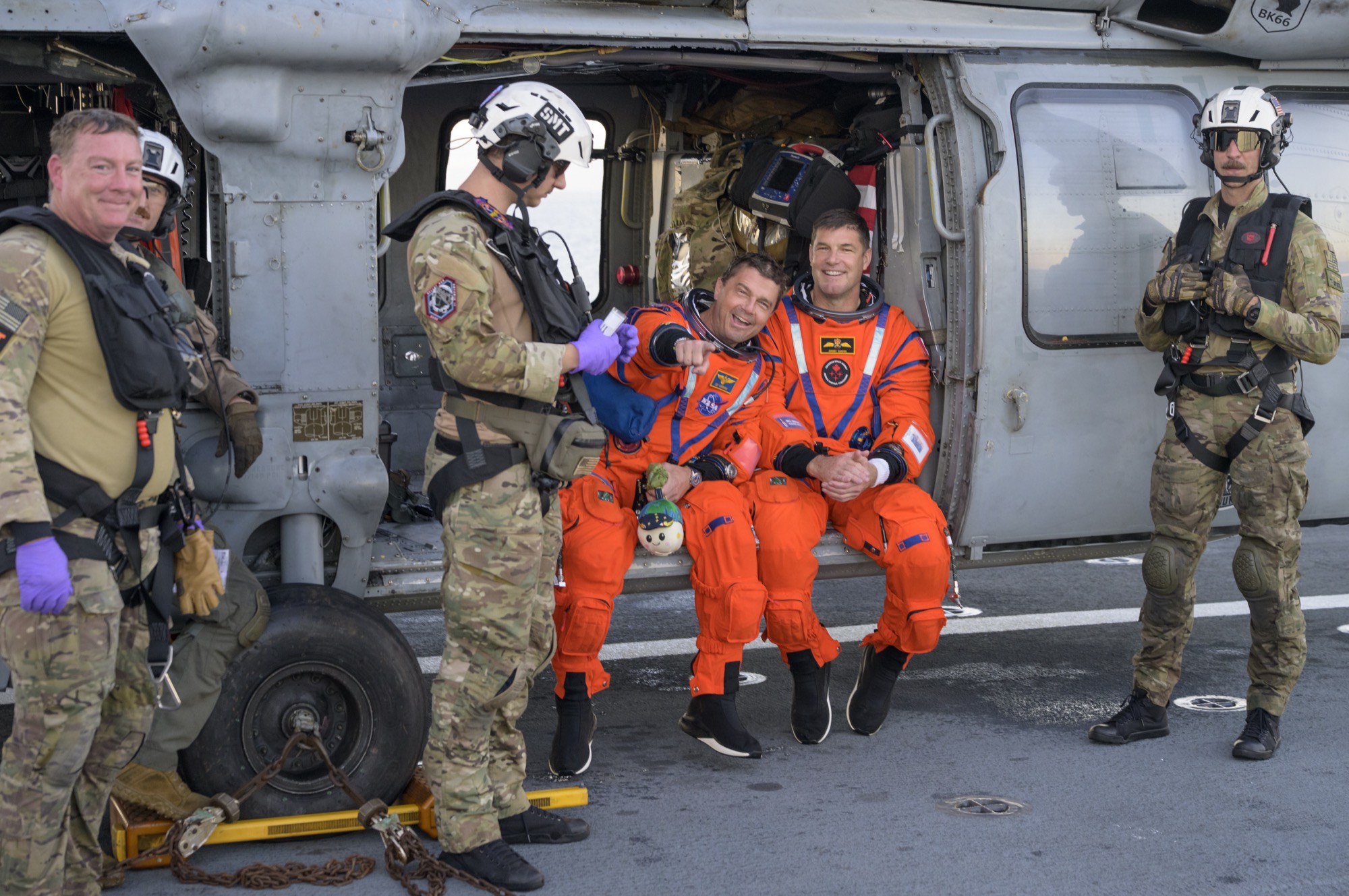Commander Reid Wiseman (left) and mission specialist Jeremy Hansen after recovery aboard USS John P. Murtha.